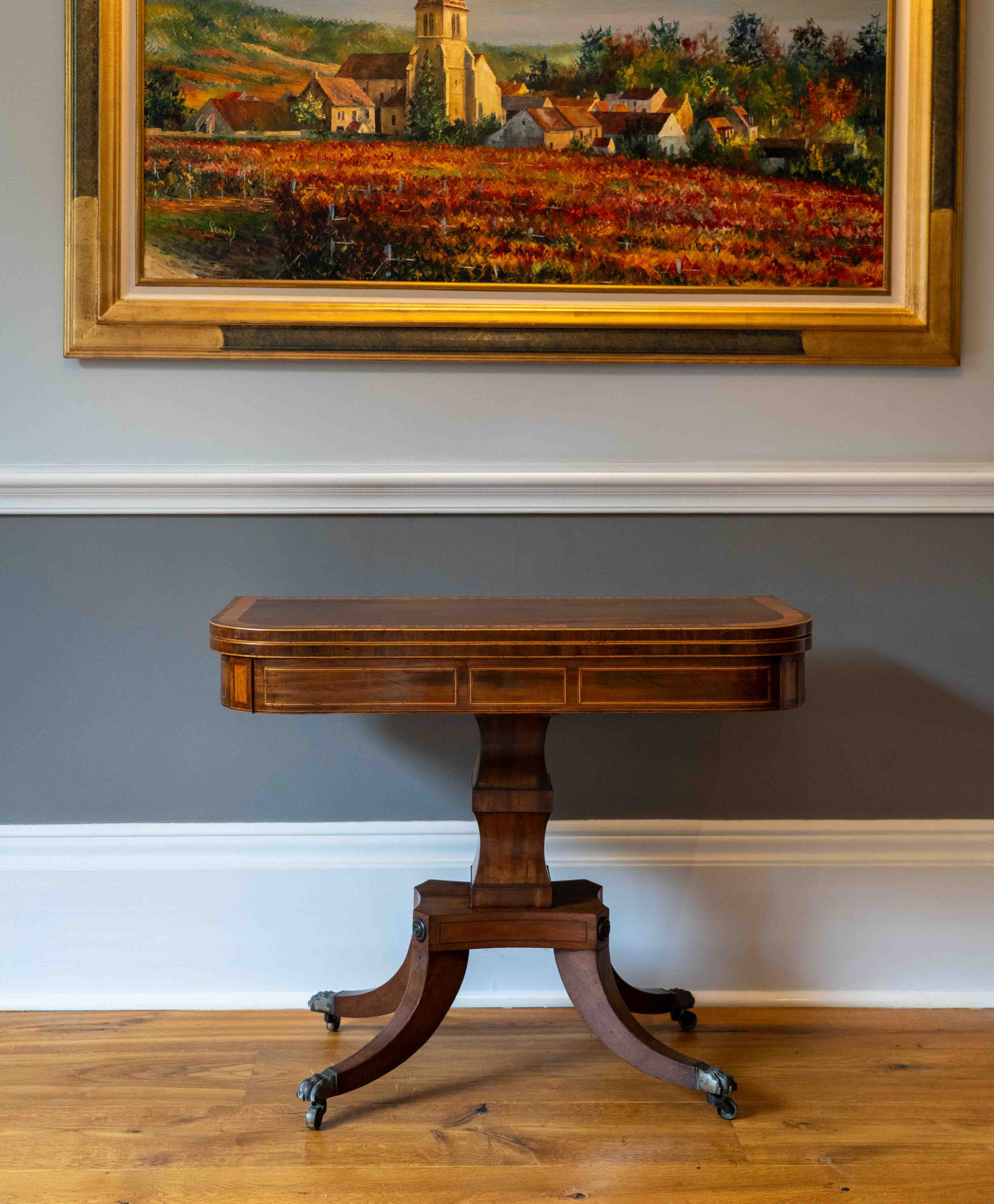 A George IV satinwood banded mahogany D shaped folding card table, width 90cm, depth 44cm, height 72cm. Condition - good